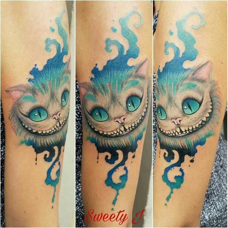 Значение тату чеширский кот